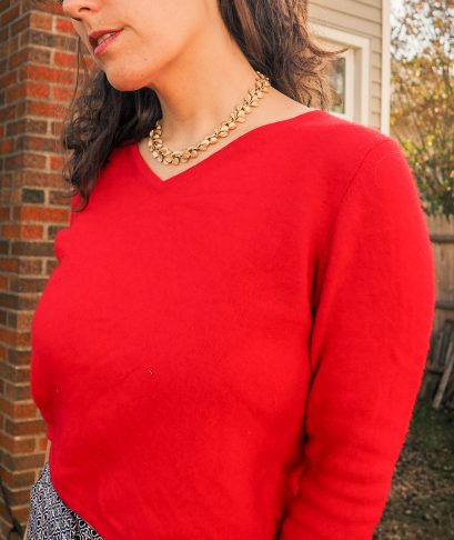 Secondhand Red cashmere sweater with gold leaf necklace