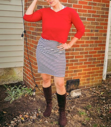 secondhand striped dress with red sweater and knee high boots